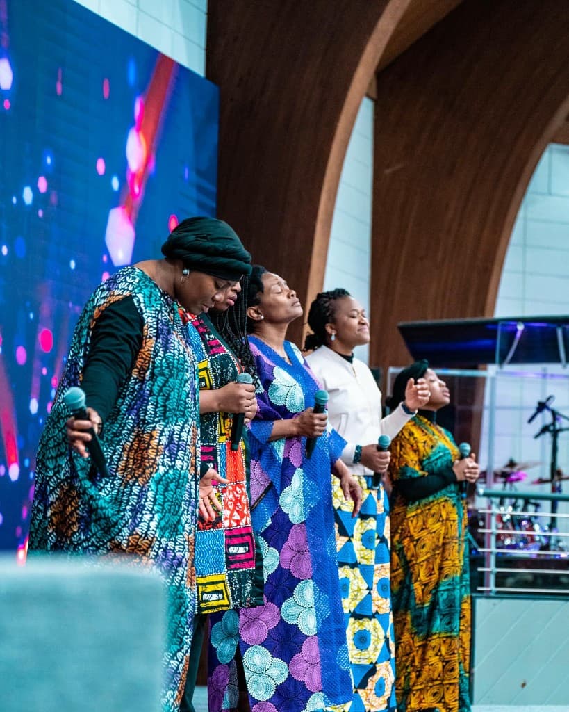 Worship team leading in song.